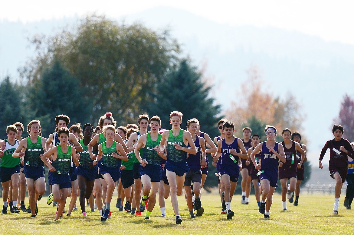 Glacier's Simon Hill, center, leads the pack at the start of the Glacier Invite at Rebecca Farm on Wednesday. Hill placed first in the boys' race. (Casey Kreider/Daily Inter Lake)