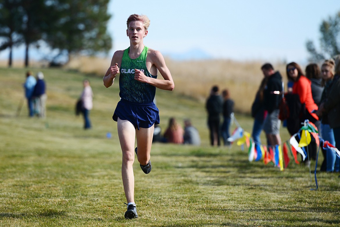 Glacier's Simon Hill heads down the home stretch at the Glacier Invite at Rebecca Farm on Wednesday. Hill placed first in the boys' race. (Casey Kreider/Daily Inter Lake)