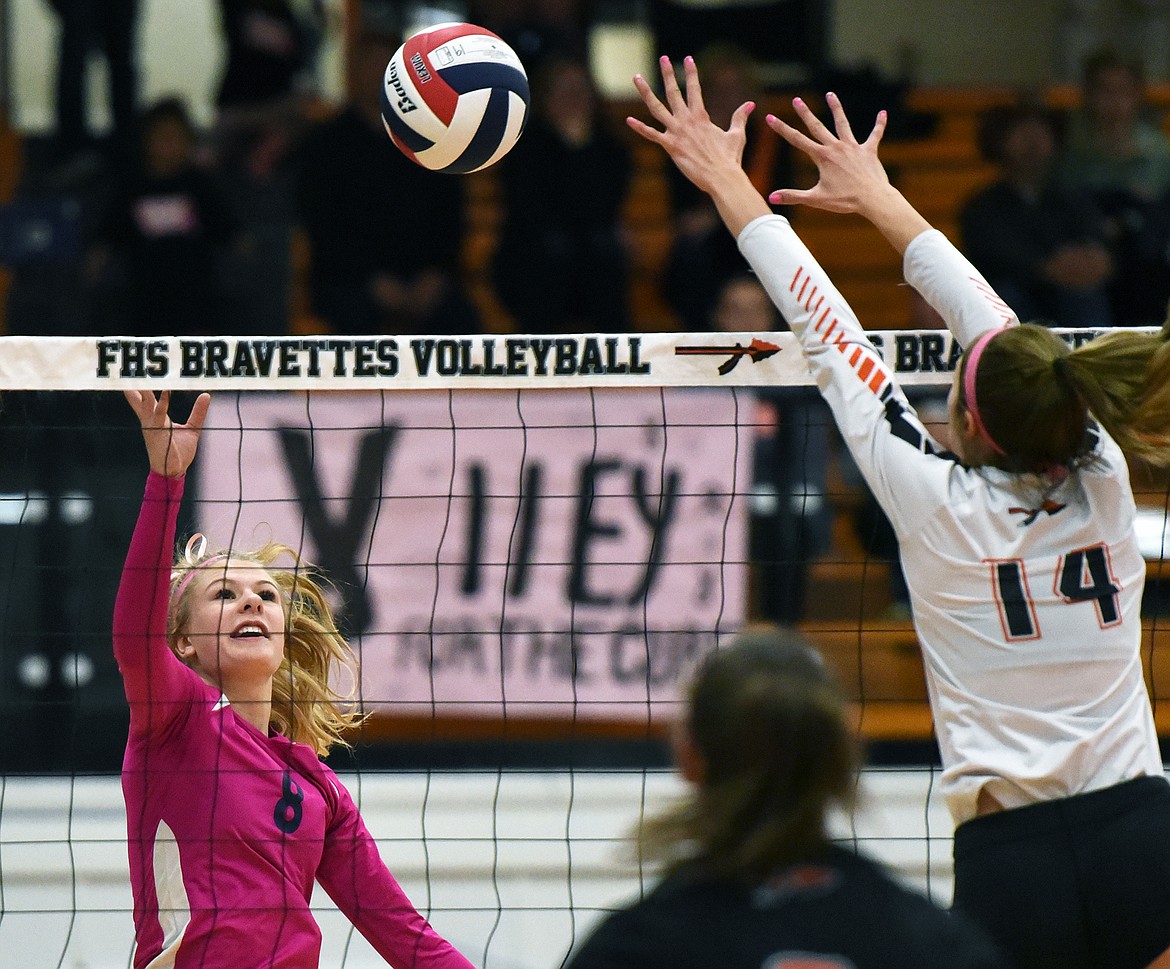 Glacier's Aubrie Rademacher (8) looks for a kill at the net against Flathead's Clare Converse (14) during crosstown volleyball at Flathead High School on Tuesday. (Casey Kreider/Daily Inter Lake)