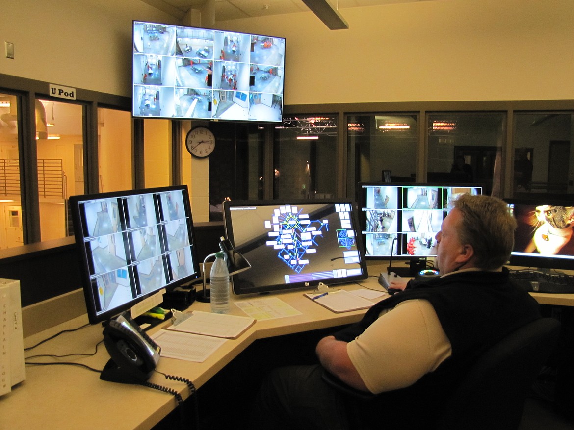 Deputy Andy Williams, control room operator, keeps an eye on inmates. (KEITH ERICKSON/Press)