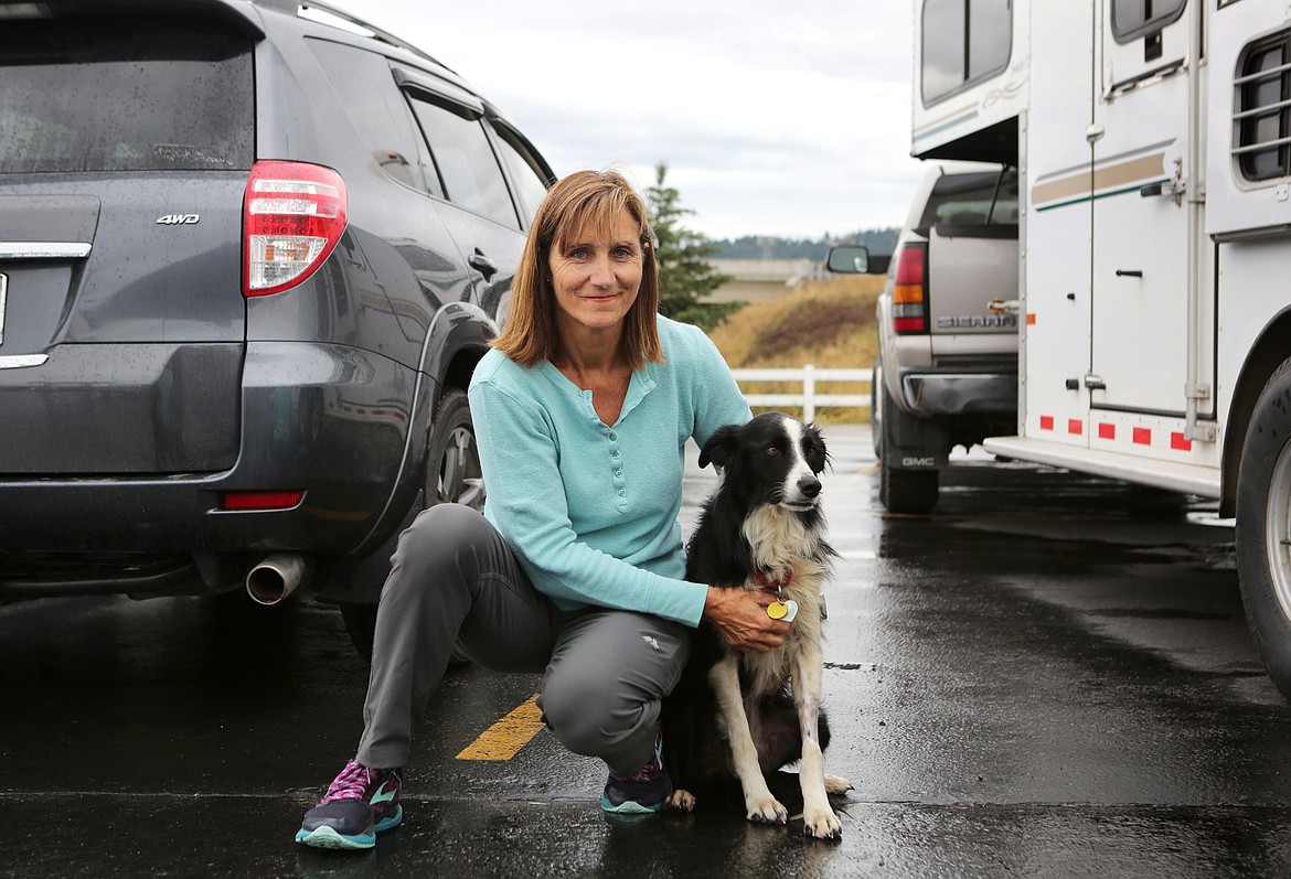 Carole King of Deer Park, Washington, holds her border collie, Katie, who went missing for 57 days before she was located in a Kalispell neighborhood. (Mackenzie Reiss/Daily Inter Lake)