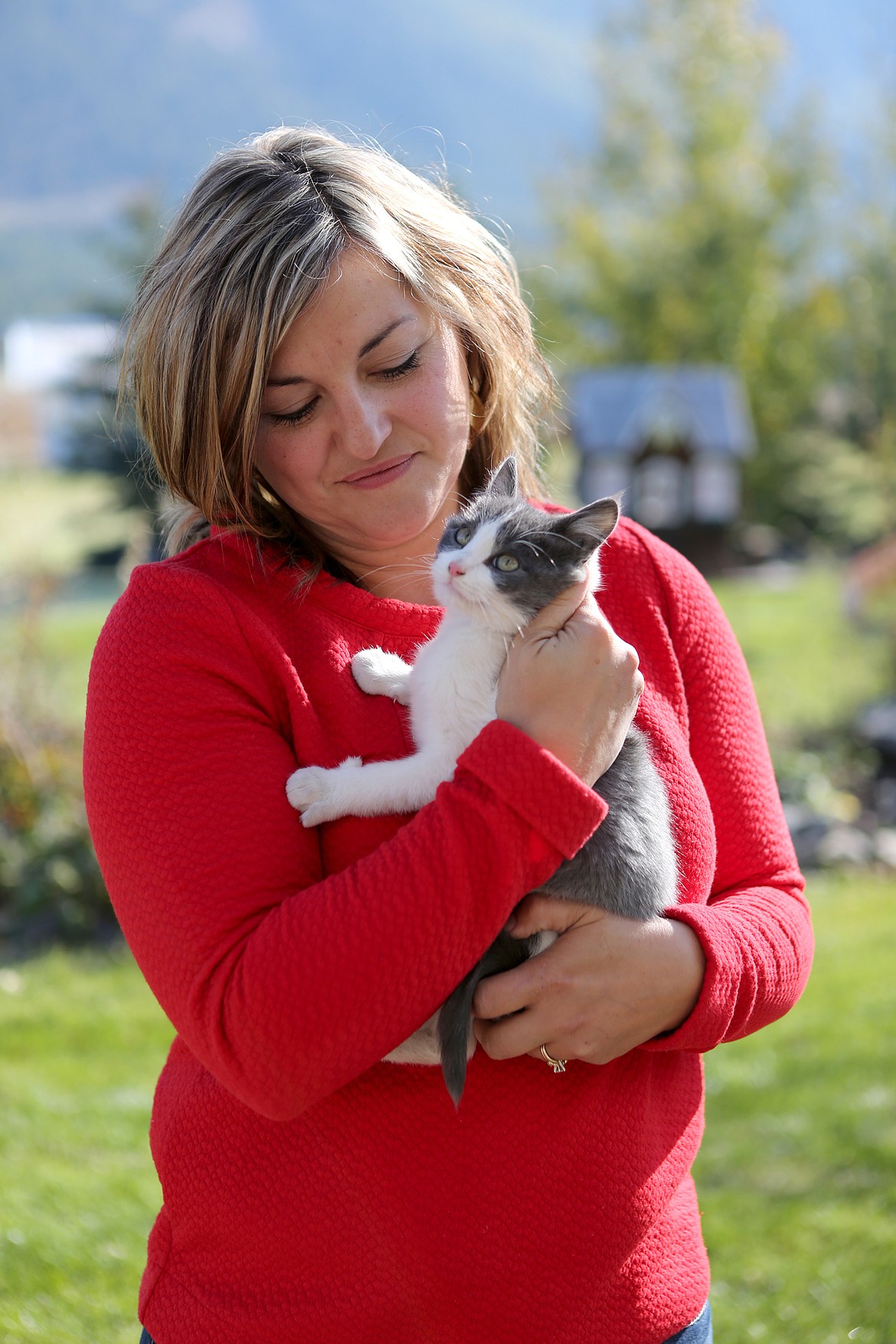 Alyson Dorr holds her kitten, Duke, outside her home in Columbia Falls.  (Mackenzie Reiss/Daily Inter Lake)
