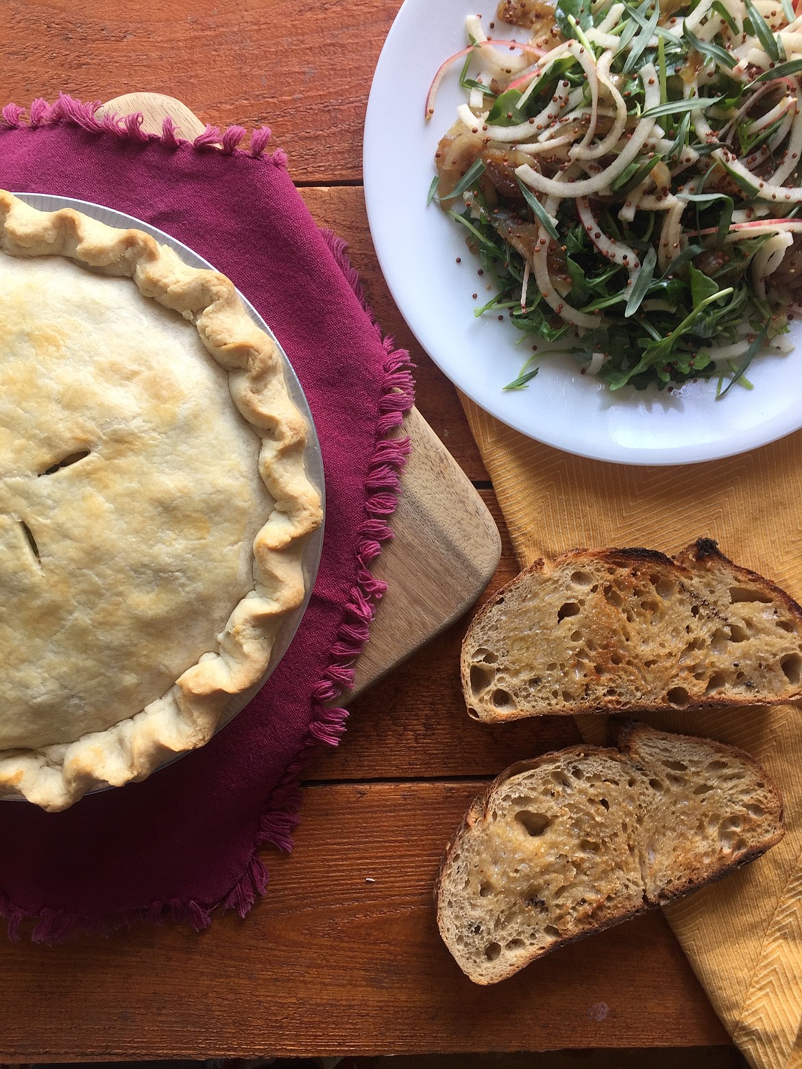 A recent home-delivery meal included broccoli cheddar macaroni and cheese pot pie from Bean &amp; Pie, an apple arugula tarragon salad from Lucid Roots, and country blonde bread with specialty butter made with Jimmy Nardello roasted peppers, from MAK Bread.