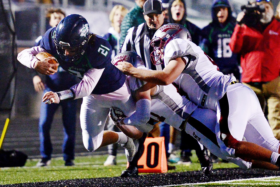 Glacier running back Casey Peiffer (21) dives for extra yardage on a first-quarter run against Helena at Legends Stadium on Friday. (Casey Kreider/Daily Inter Lake)