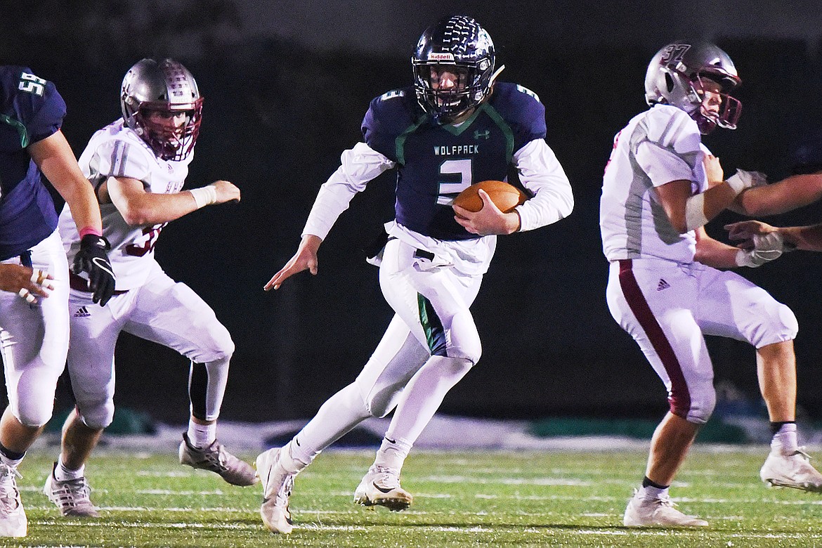 Glacier quarterback JT Allen (3) is chased from the pocket against Helena at Legends Stadium on Friday. (Casey Kreider/Daily Inter Lake)
