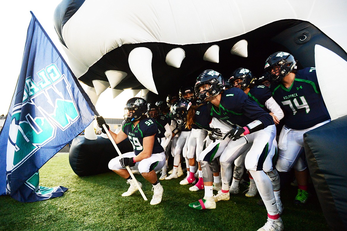 The Glacier Wolfpack wait to take the field against Helena High at Legends Stadium on Friday. (Casey Kreider/Daily Inter Lake)