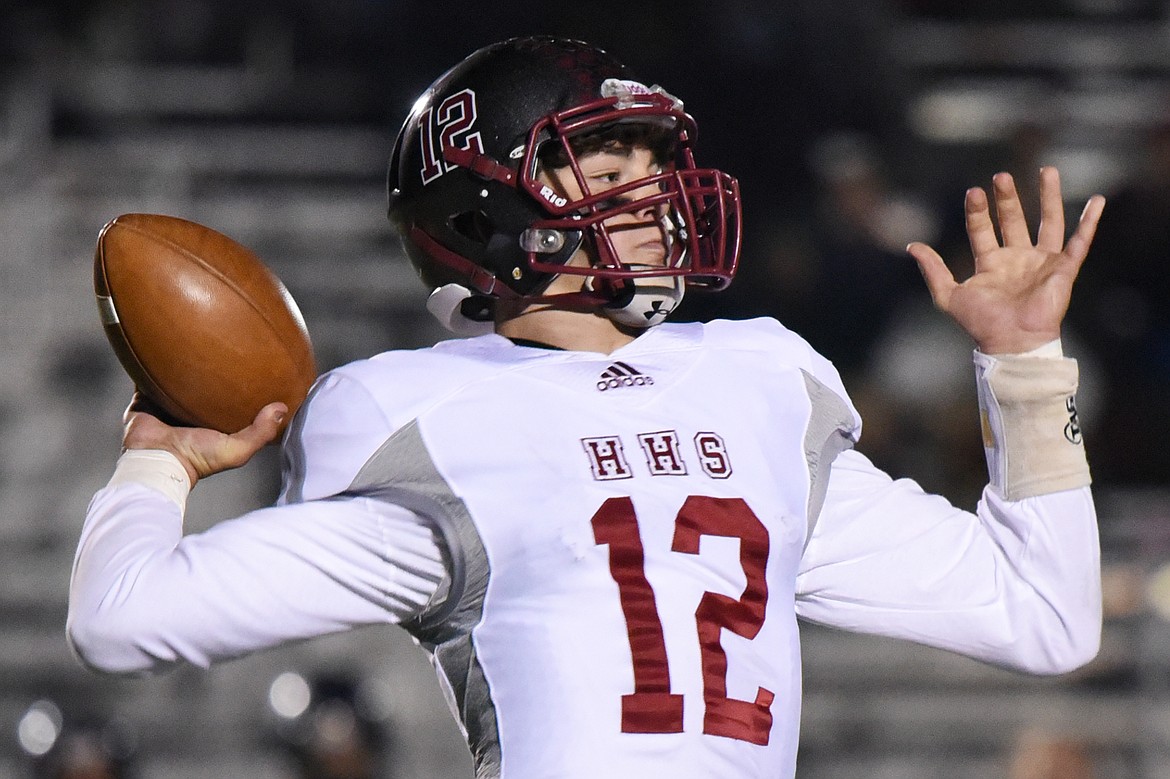 Helena quarterback Kaden Huot (12) looks to throw against Glacier at Legends Stadium on Friday. (Casey Kreider/Daily Inter Lake)