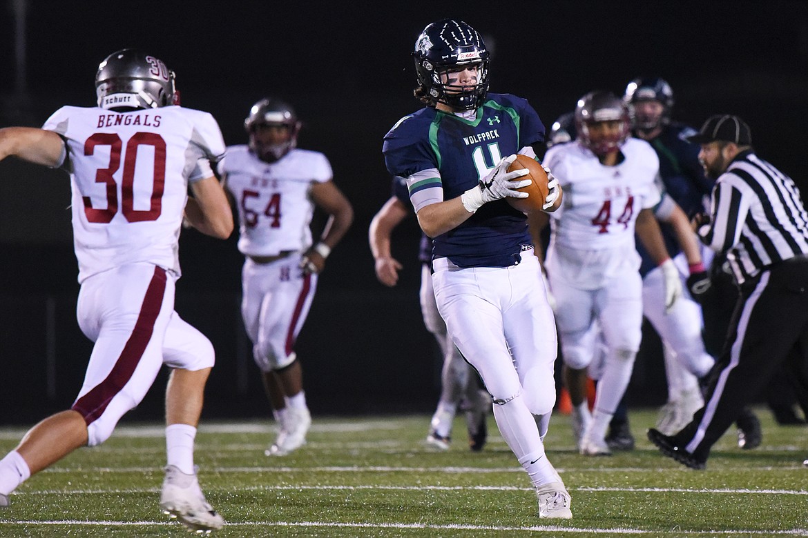 Glacier wide receiver Luke Bilau (4) makes a catch over the middle in the second quarter against Helena at Legends Stadium on Friday. (Casey Kreider/Daily Inter Lake)