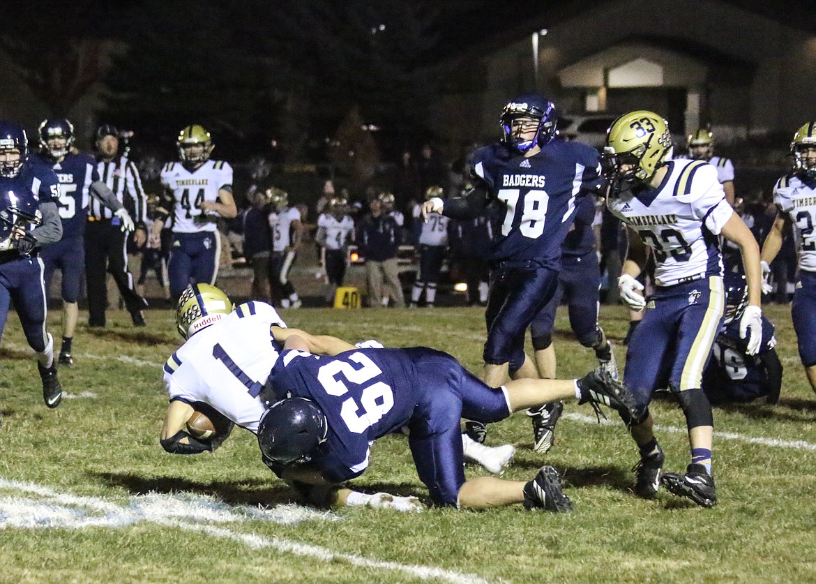 Photo by MANDI BATEMAN
Tackle by the Badgers during the Homecoming game.