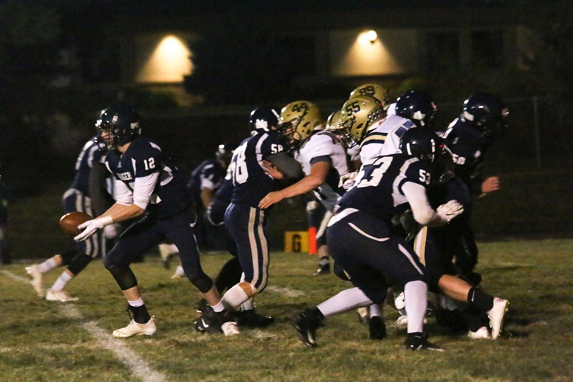 Photo by MANDI BATEMAN
The Badgers battle Timberlake during Friday&#146;s homecoming game. For coverage of the football game, see Sports, page B1.