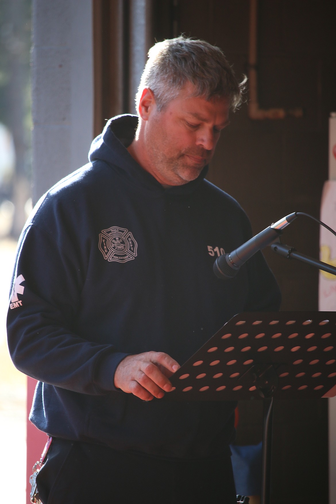 Photo by MANDI BATEMAN
Hall Mountain Firefighter Marty Steinhagen reading from the list of fallen firefighters.