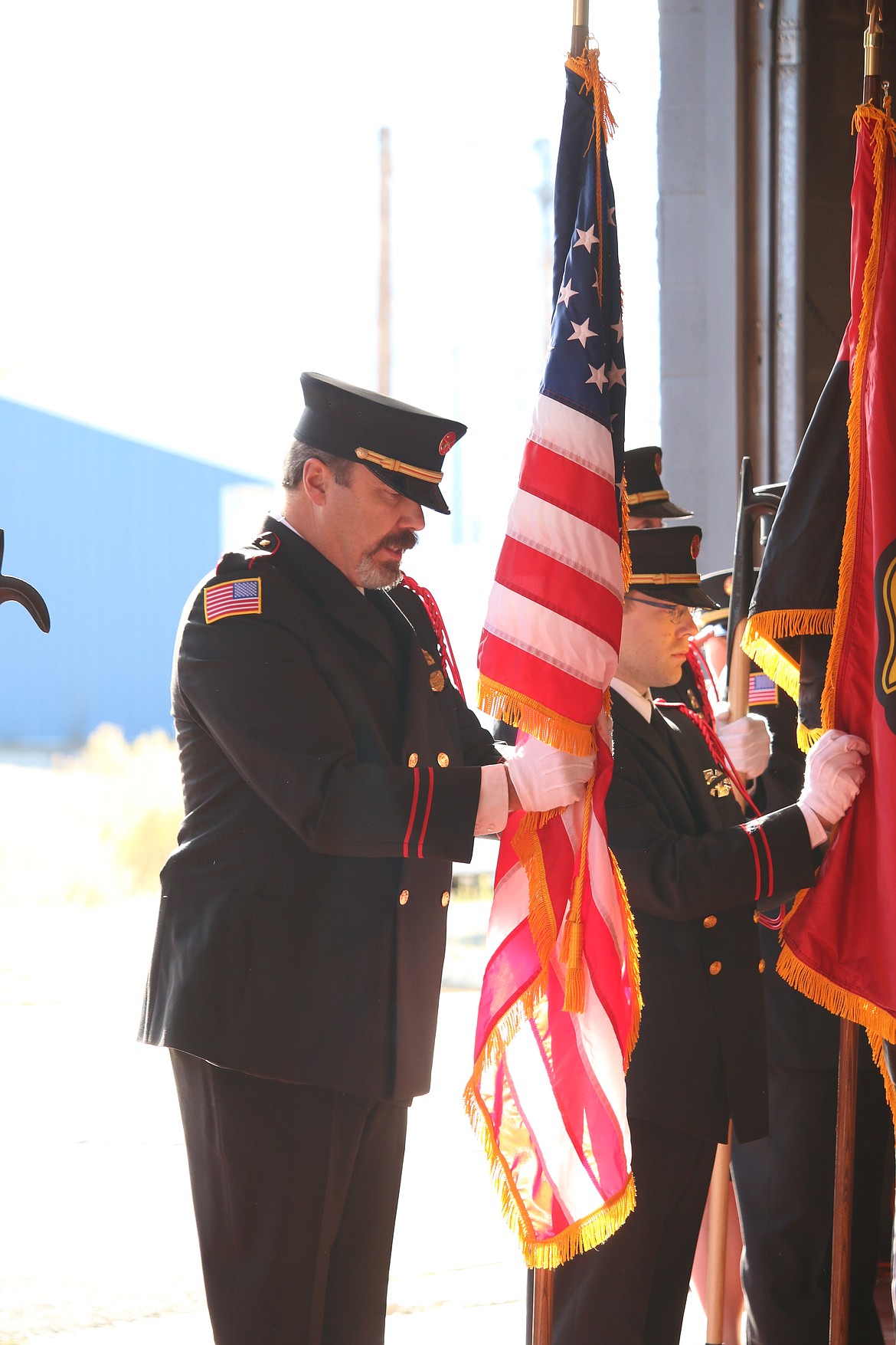 Photo by MANDI BATEMAN
Boundary County Chaplian Corp Presiden,t Len Pine, presenting the colors as part of the honor guard.