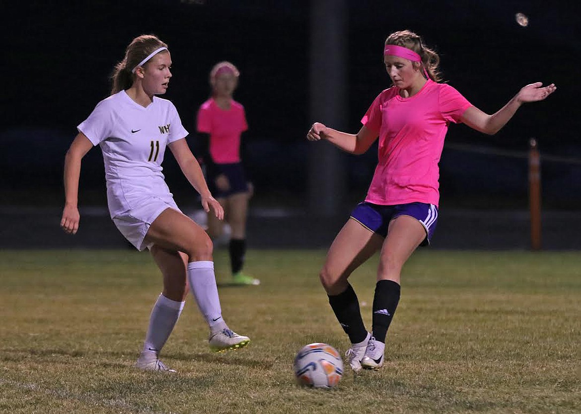 Polson Lady Pirate Tia Mercer passed to a teammate in their Senior Night game last week. (Bob Gundstrom)