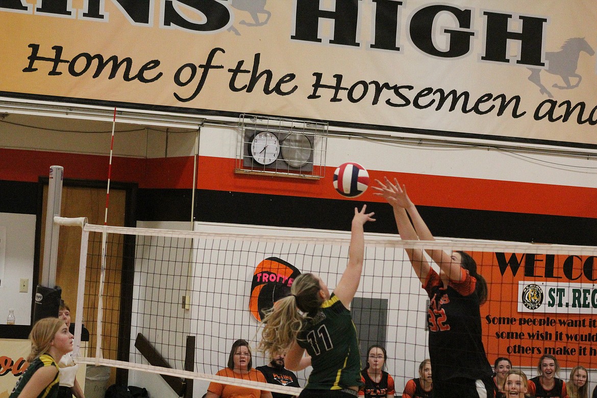 KYLEE THOMPSON spikes the ball against Plains for a point last Thursday. (John Dowd/Clark Fork Valley Press)