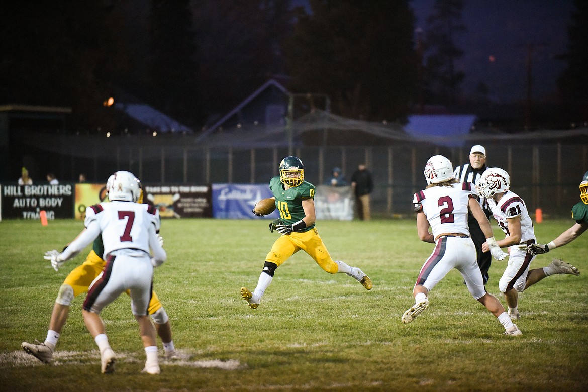 Devin Beale looks for room to run in the Bulldogs' home loss to Hamilton. (Daniel McKay/Whitefish Pilot)
