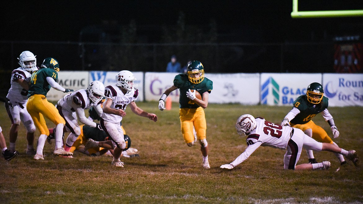 Bodie Smith finds a hole in the defense in the Bulldogs&#146; home loss to Hamilton. (Daniel McKay/Whitefish Pilot)