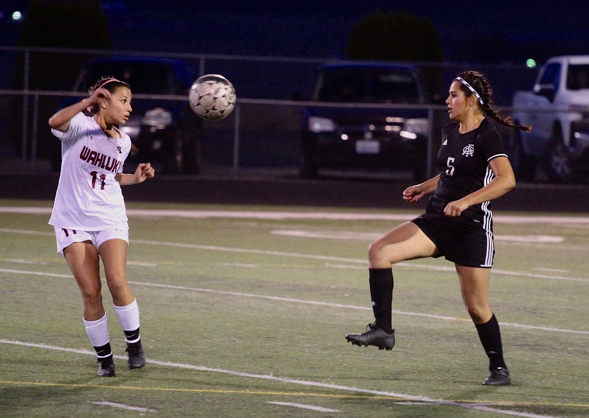 Casey McCarthy/Columbia Basin Herald Royal's Grecia Santillan and Wahluke's Ana Garcia jostle for the ball near the middle of the field on Thursday as the Knights handed the Warriors their first conference loss of the season.