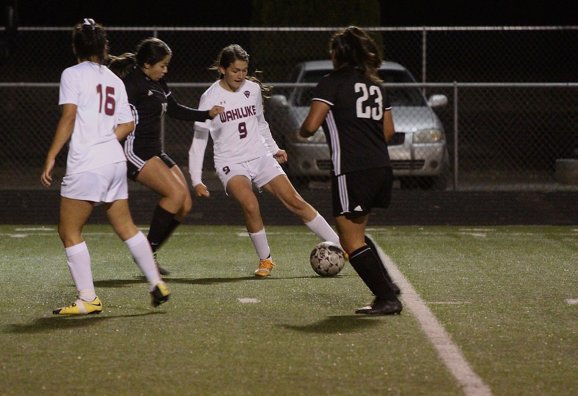 Casey McCarthy/Columbia Basin Herald Wahluke's Alondra Lozano makes the pass towards the middle for the Warriors on Thursday night against Royal.