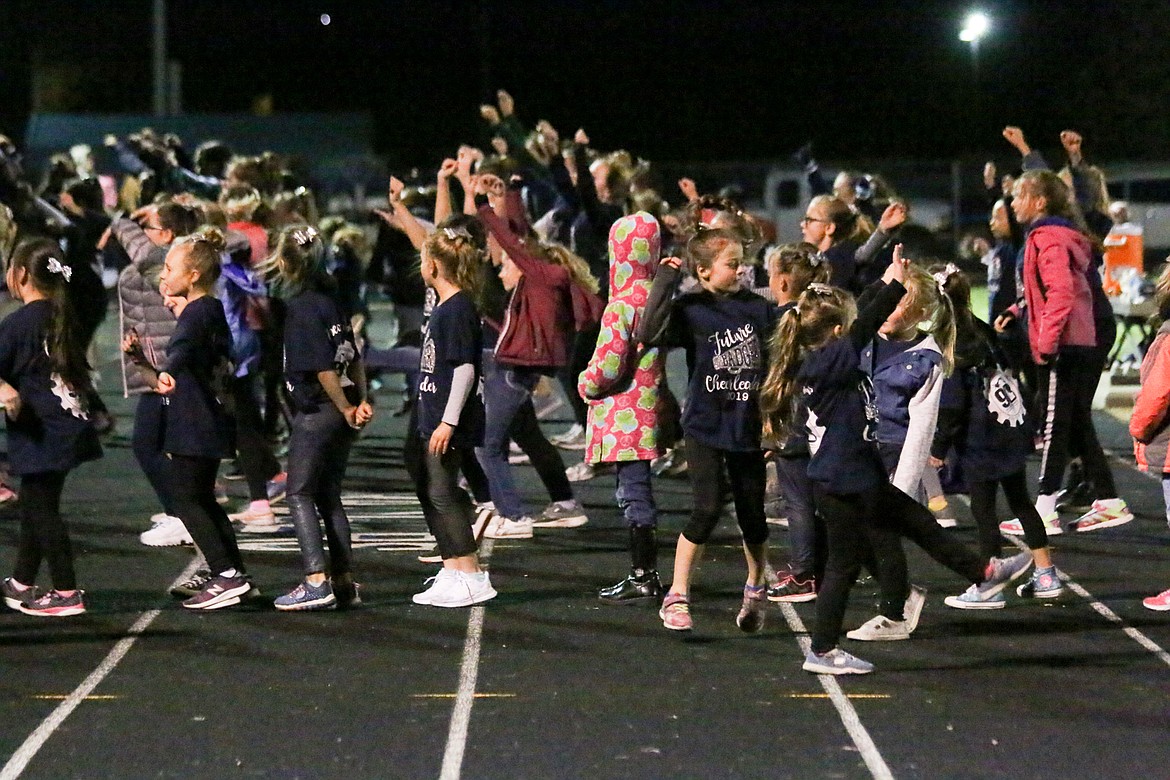 Photo by MANDI BATEMAN
Young cheerleaders join with the BFHS cheer squad to fire up the crowd at Friday&#146;s football game.