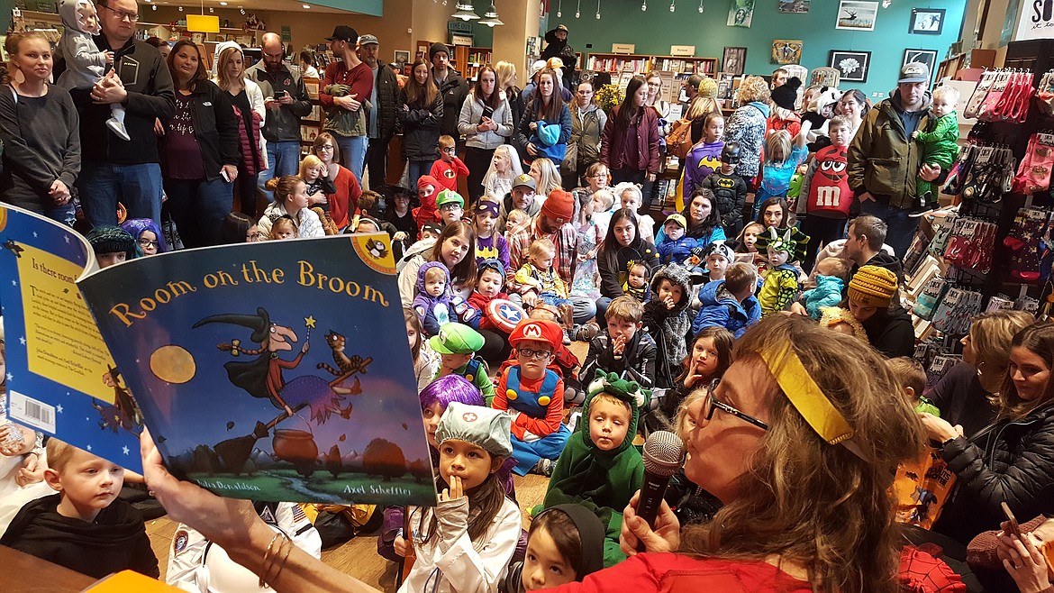 Michelle Reitman read Halloween themed stories at the annual Well-Read Moose Bookstore Halloween storytime and Trick-or-Treat for a book on Saturday. More than 200 kids received a free book to take home.