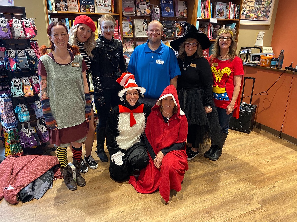 The Well~Read Moose staff all dressed up for party. Pictured (from left) are Jenny Twitchell, Hannah Prevost, Anna Rose Carleton, Derrick Brunner, Mellie Chun, Michelle Reitman, (kneeling in front) Melissa Demonte and Marlene Craig.