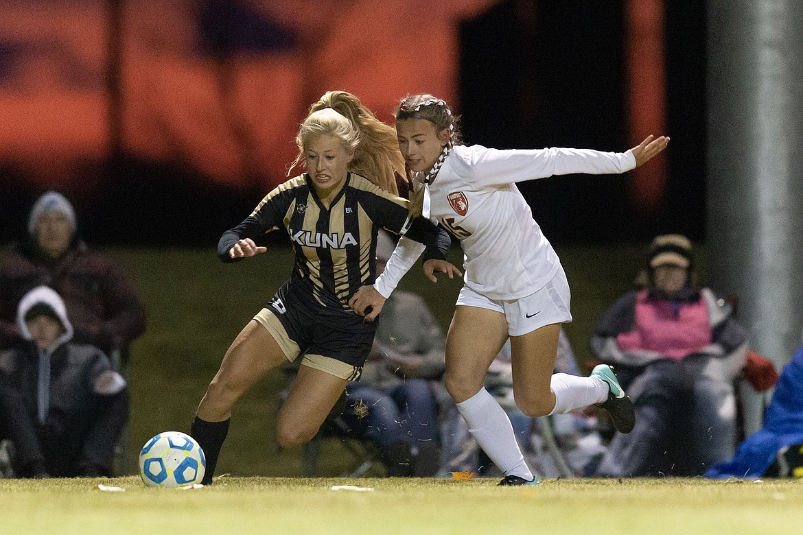 (Photo courtesy of JASON DUCHOW PHOTOGRAPHY)
Junior forward Jordie Breeden battles a Kuna defender of possession of the ball during the 4A state championship Saturday night at Middleton High School.