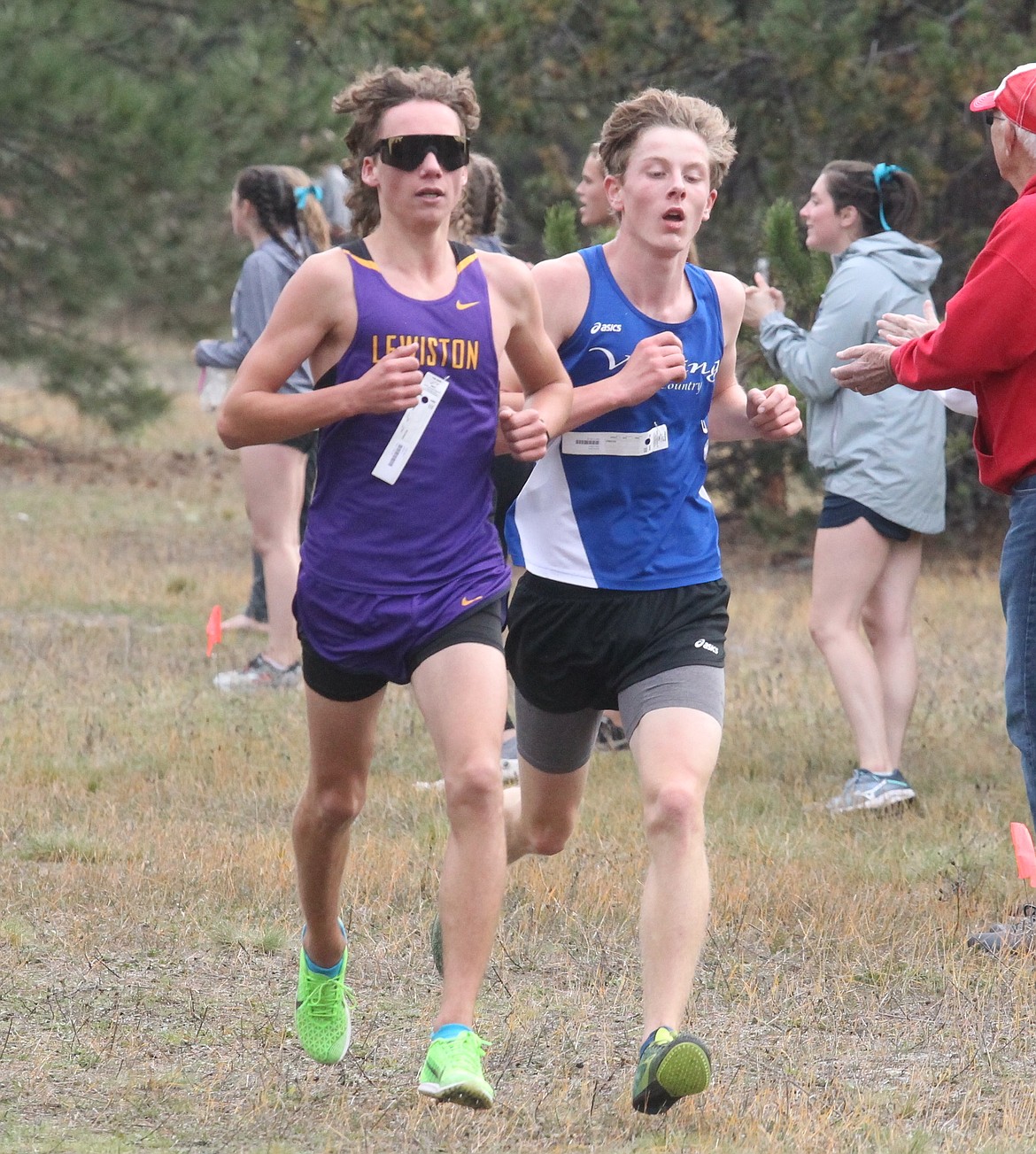 JASON ELLIOTT
Coeur d&#146;Alene&#146;s Braden Dance attempts to pass Lewiston&#146;s Caden Byrer midway into the 5A Region 1 boys race at Farragut State Park on Thursday in Athol. Byrer won the 5A race, with Dance finishing second.