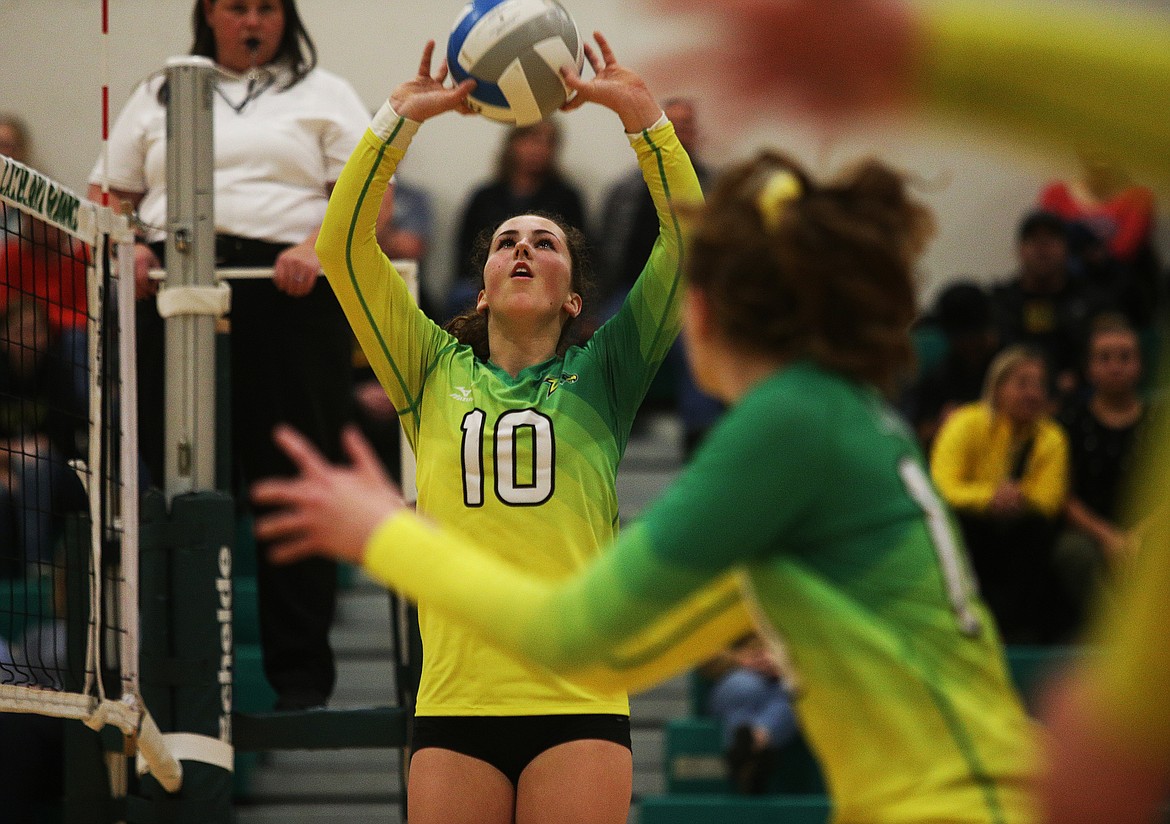 Lakeland High&#146;s Abigail Neff sets the ball to a teammate during the 4A Region 1 championship match Thursday in Rathdrum. (LOREN BENOIT/Press)