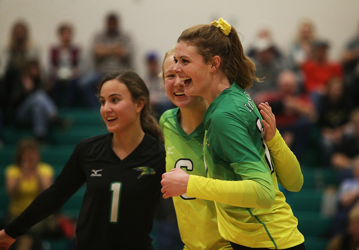 Lakeland&#146;s Olivia Cooper (1), Addisen Kiefer (6) and Bethany Johnson celebrate a point in the 4A Region 1 championship match against Moscow. (LOREN BENOIT/Press)