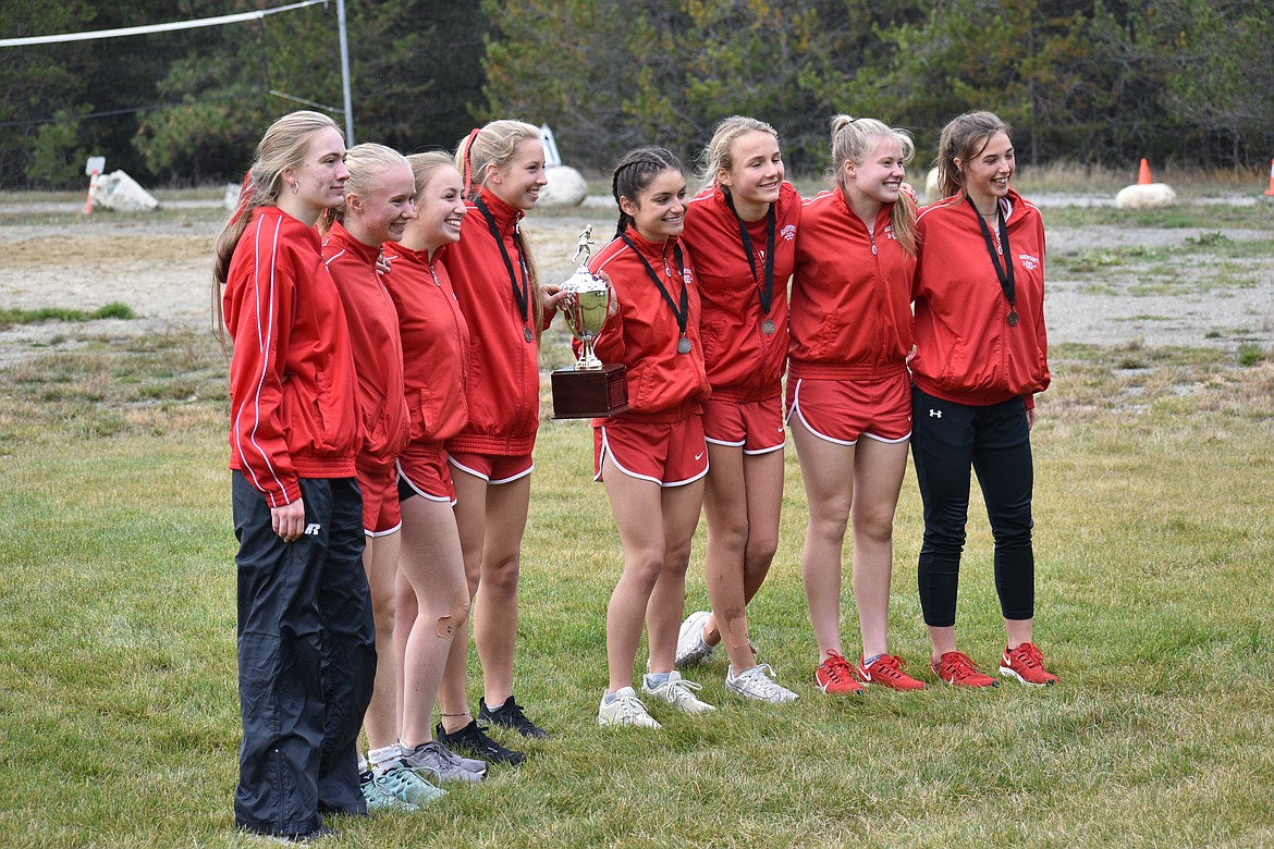 (Photo by DYLAN GREENE)
The Sandpoint girls cross country team poses for a photo with the district trophy after winning it for a seventh year in a row Thursday.