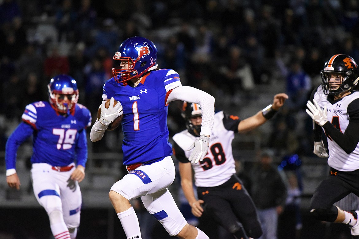 Bigfork defensive back Isak Epperly (1) returns an interception in the second quarter against Eureka at Bigfork High School on Friday. (Casey Kreider/Daily Inter Lake)