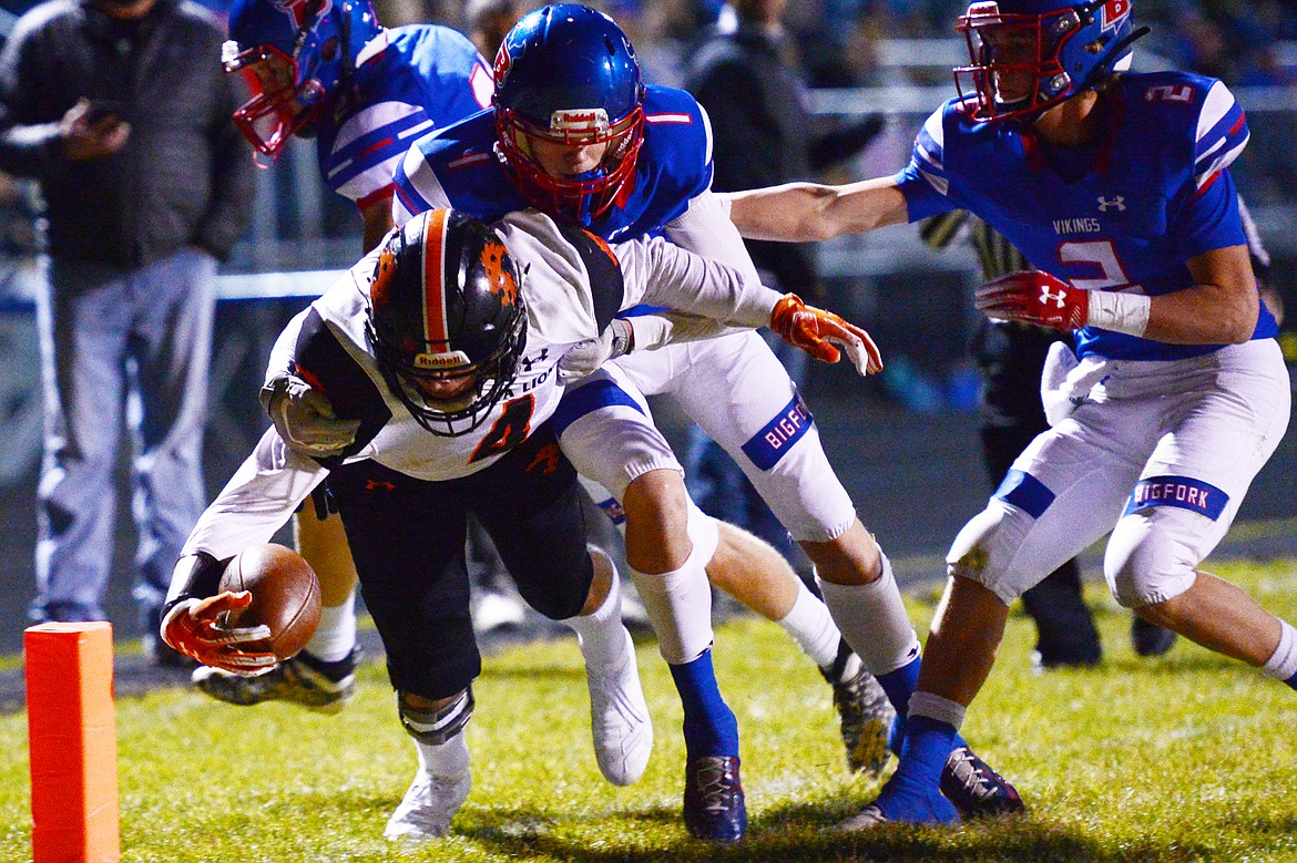 Eureka running back Chet McCully reaches across the goaline on a two-point conversion try in the first quarter against Bigfork at Bigfork High School on Friday. (Casey Kreider/Daily Inter Lake)