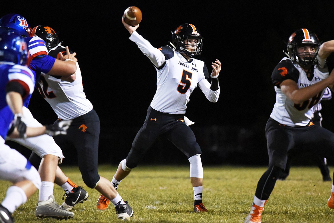 Eureka quarterback Hank Dunn (5) looks to throw in the first quarter against Bigfork at Bigfork High School on Friday. (Casey Kreider/Daily Inter Lake)