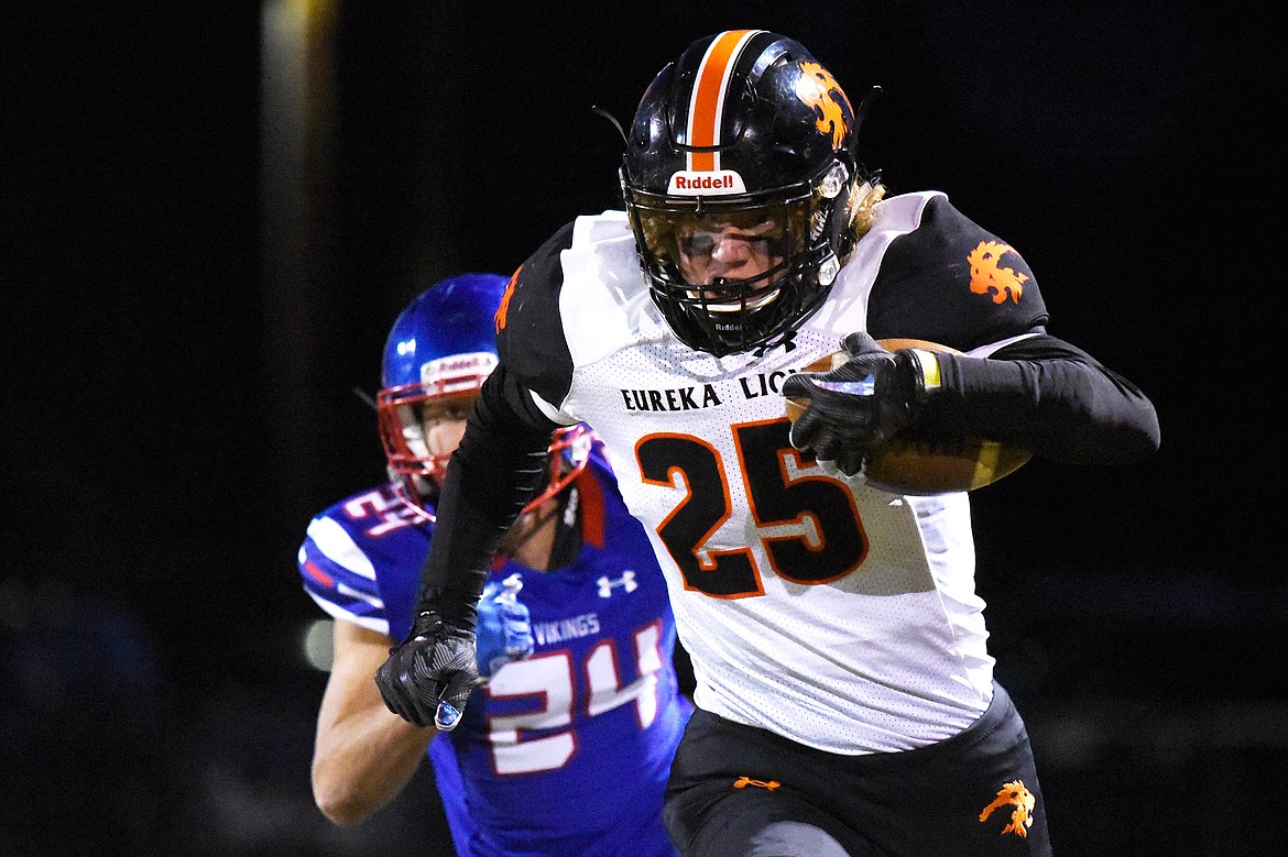 Eureka tight end Cory Chaney (25) heads upfield after a reception in the first quarter against Bigfork at Bigfork High School on Friday. (Casey Kreider/Daily Inter Lake)