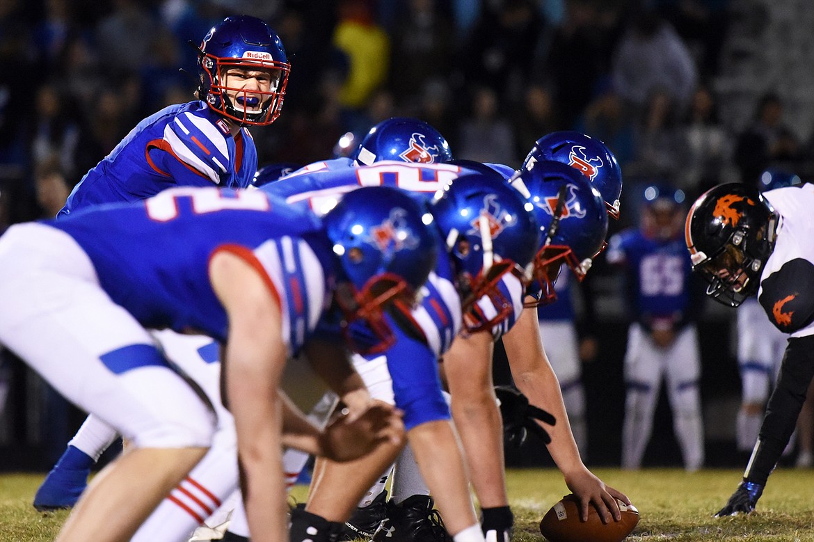 Bigfork quarterback Patrick Wallen (2) calls out his pre-snap cadence in the first quarter against Eureka at Bigfork High School on Friday. (Casey Kreider/Daily Inter Lake)