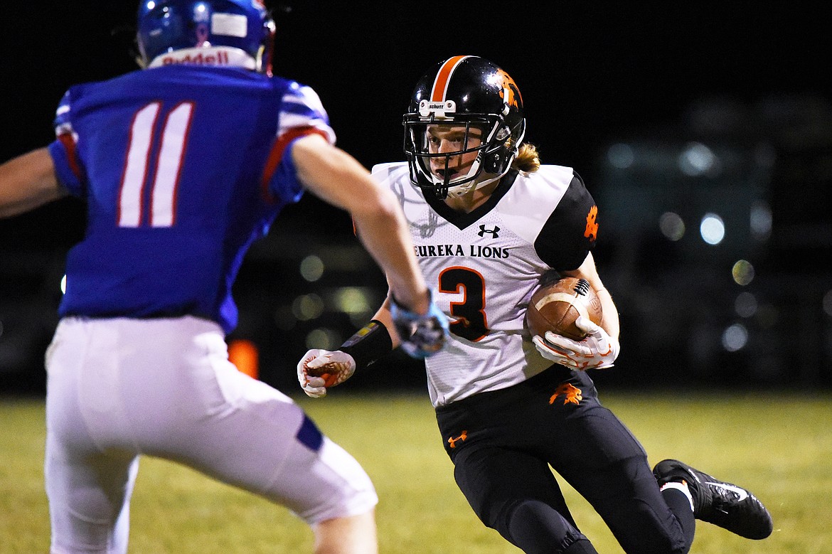 Eureka wide receiver AJ Pacella (3) looks to run after a first quarter reception against Bigfork at Bigfork High School on Friday. (Casey Kreider/Daily Inter Lake)