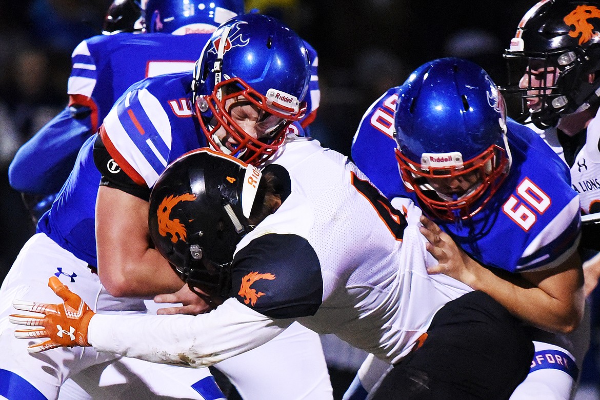 Bigfork running back Levi Taylor (3) collides with Eureka linebacker Chet McCully (4) on a first quarter run at Bigfork High School on Friday. (Casey Kreider/Daily Inter Lake)