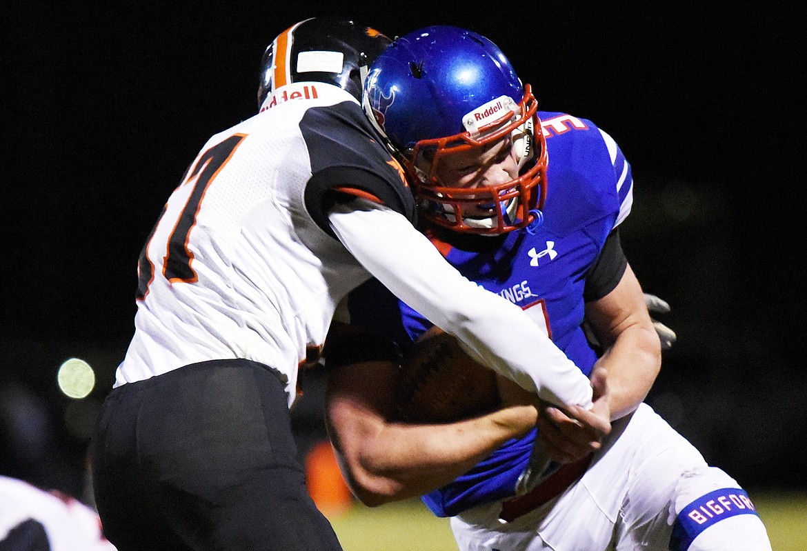 Bigfork running back Levi Taylor (3) is tackled by Eureka defensive back Grady Seal (57) in the second quarter at Bigfork High School on Friday. (Casey Kreider/Daily Inter Lake)