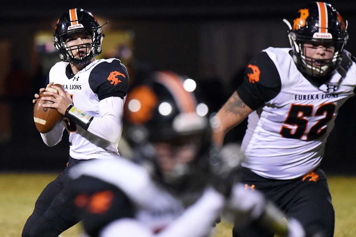 Eureka quarterback Hank Dunn (5) looks to throw in the second quarter against Bigfork at Bigfork High School on Friday. (Casey Kreider/Daily Inter Lake)