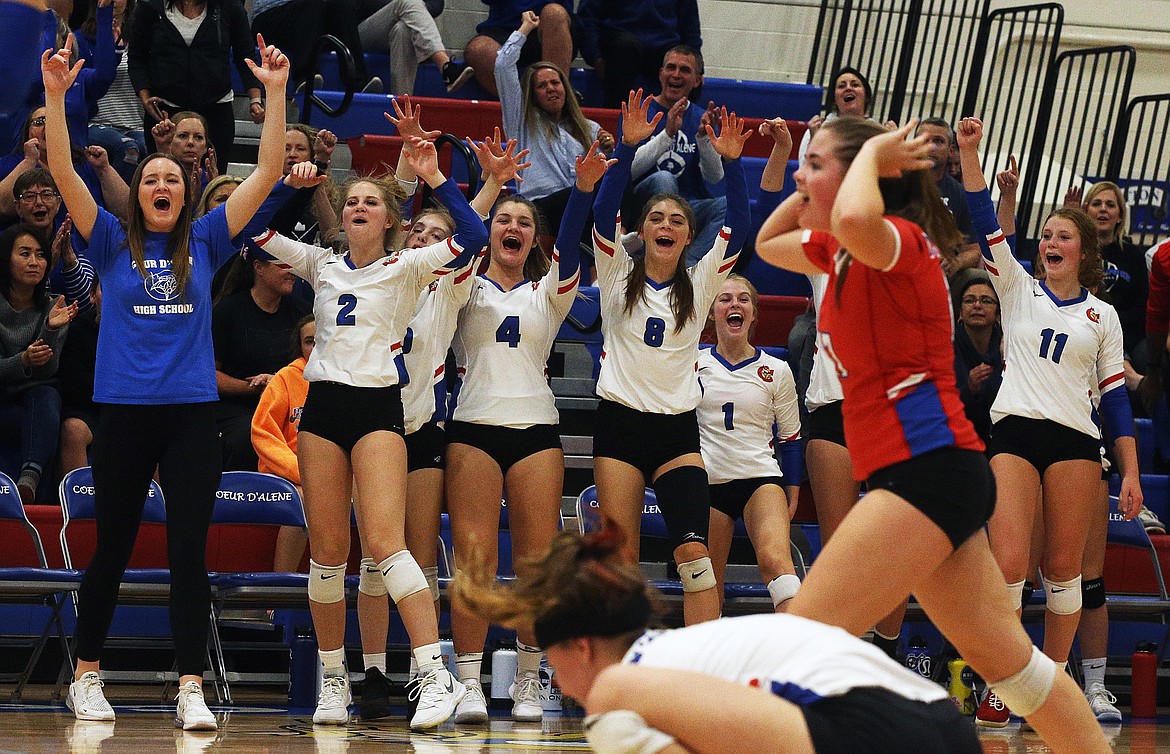 LOREN BENOIT/Press
The Coeur d&#146;Alene bench celebrates a key block point in the third set of the 5A Region 1 championship match against Lake City Tuesday night at Viking Court. The Vikings swept the Timberwolves in three sets.