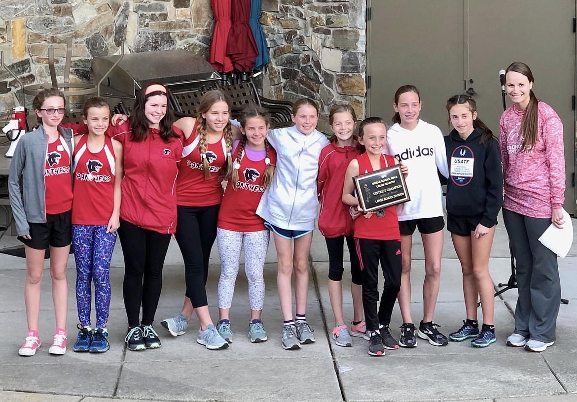 Courtesy photo
The Coeur d&#146;Alene Charter Academy girls won the middle school cross country district championship Oct. 16 at Ramsey Park, completing an undefeated fall season. From left are Natal Davis, Cecelia Jones, Jane Robinson, Emma Fisch, Amy Fisch, Helen Oyler, Aubrey Curry, Olivia May, Ann Marie Dance, Zara Munyer and coach Bright. Not pictured are Alexandria and Elizabeth Montgomery, Ana Pierowski, Annabelle Carr, Ariana Wohletz, Ashlyn Craigie, Elisabeth Pjesky, Evalie Hildesheim, Kara Grossman, Olivia Rhodes, Peyton Duffield, Rebekah Liew-Nguyen, Samantha Taub and Coach York.