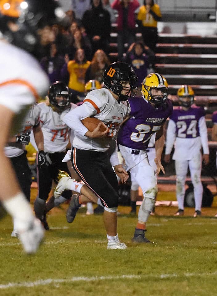 Photo by ANA PEARSE
Post Falls quarterback Derek Pearse rushes upfield in last Fridays 41-40 victory at Lewiston. Ana Pearse, Dereks sister, is studying art and photography at Oregon State.