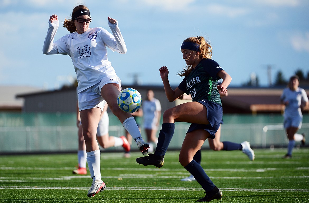 Glacier's Madison Becker (18) battles Butte's Brie Birkenbuel (22) for possession at Legends Stadium on Tuesday. (Casey Kreider/Daily Inter Lake)