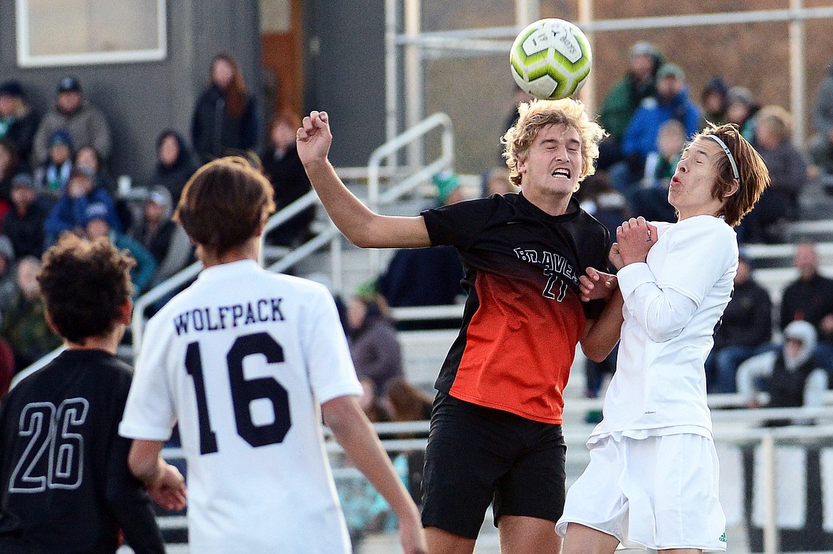 Flathead's Ethan Vandenbosch (21) and Glacier's Sol Dalla Betta (13) battle for a header off a Flathead corner kick at Legends Stadium on Tuesday. (Casey Kreider/Daily Inter Lake)