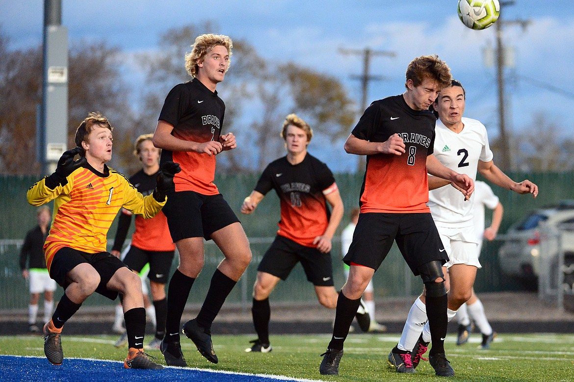 Flathead's Kell Rasnic (8) and Glacier's Diego Mendoza (2) battle for a header near the Flathead goal at Legends Stadium on Tuesday. (Casey Kreider/Daily Inter Lake)