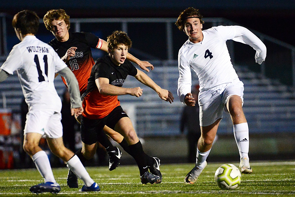 Glacier's Braden Nitschelm (4) works the ball upfield against Flathead at Legends Stadium on Tuesday. (Casey Kreider/Daily Inter Lake)