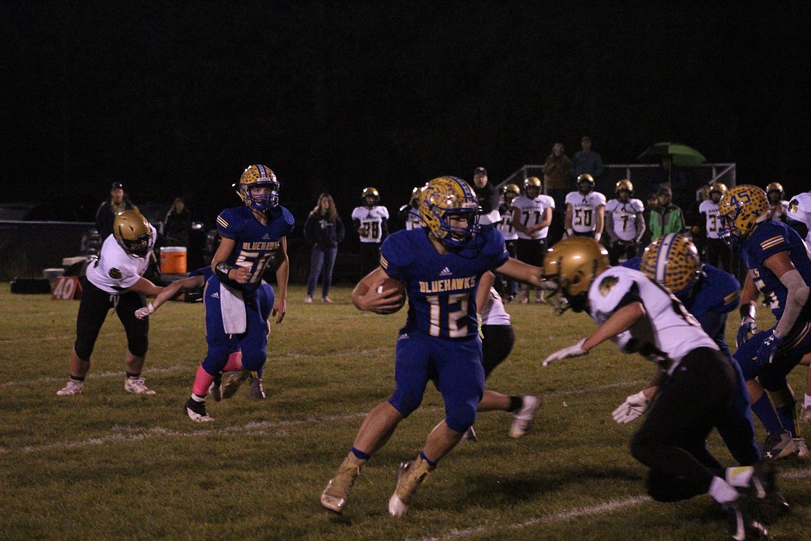 TREY FISHER runs the ball up the middle for a touchdown for the Blue Hawks against Seeley-Swan last week. (John Dowd/Clark Fork Valley Press)