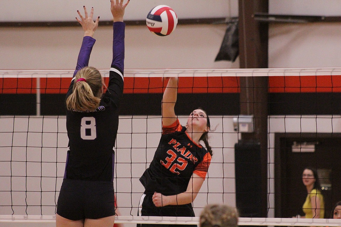 KYLEE ALTMILLER spiking against Charlo during the game last Thursday. (John Dowd/Clark Fork Valley Press)