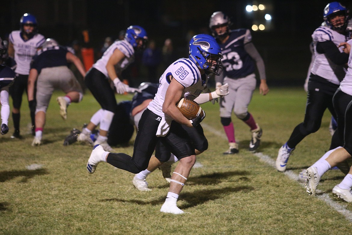 Coeur d&#146;Alene&#146;s Gunner Giulio rushes the ball upfield against Lake City during Friday night&#146;s game.