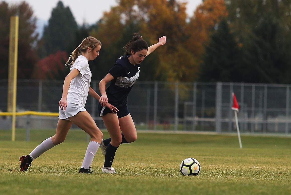 Lake City&#146;s Sydney Harbison dribbles the ball next to Coeur d&#146;Alene&#146;s Tierra Lambert during the 5A Region 1 championship game.